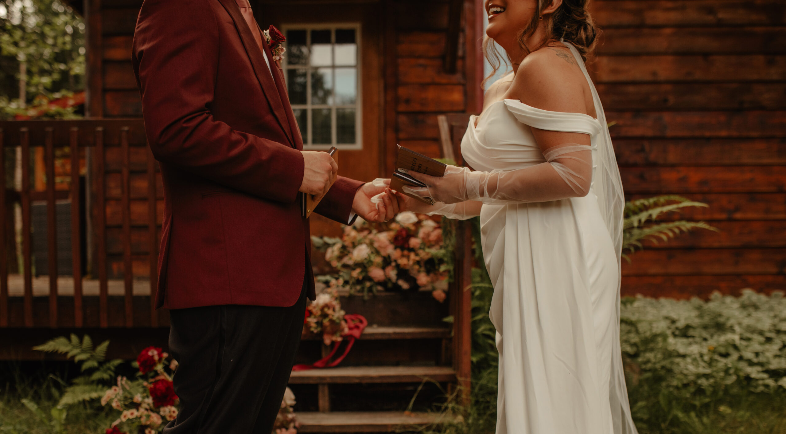 Intimate Elopement between Man and Woman at Alaskan Cabin with burgundy and Mauve colors